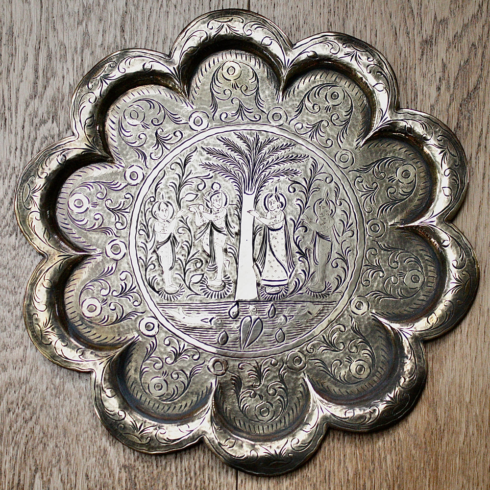 an antique Indian engraved brass thali.