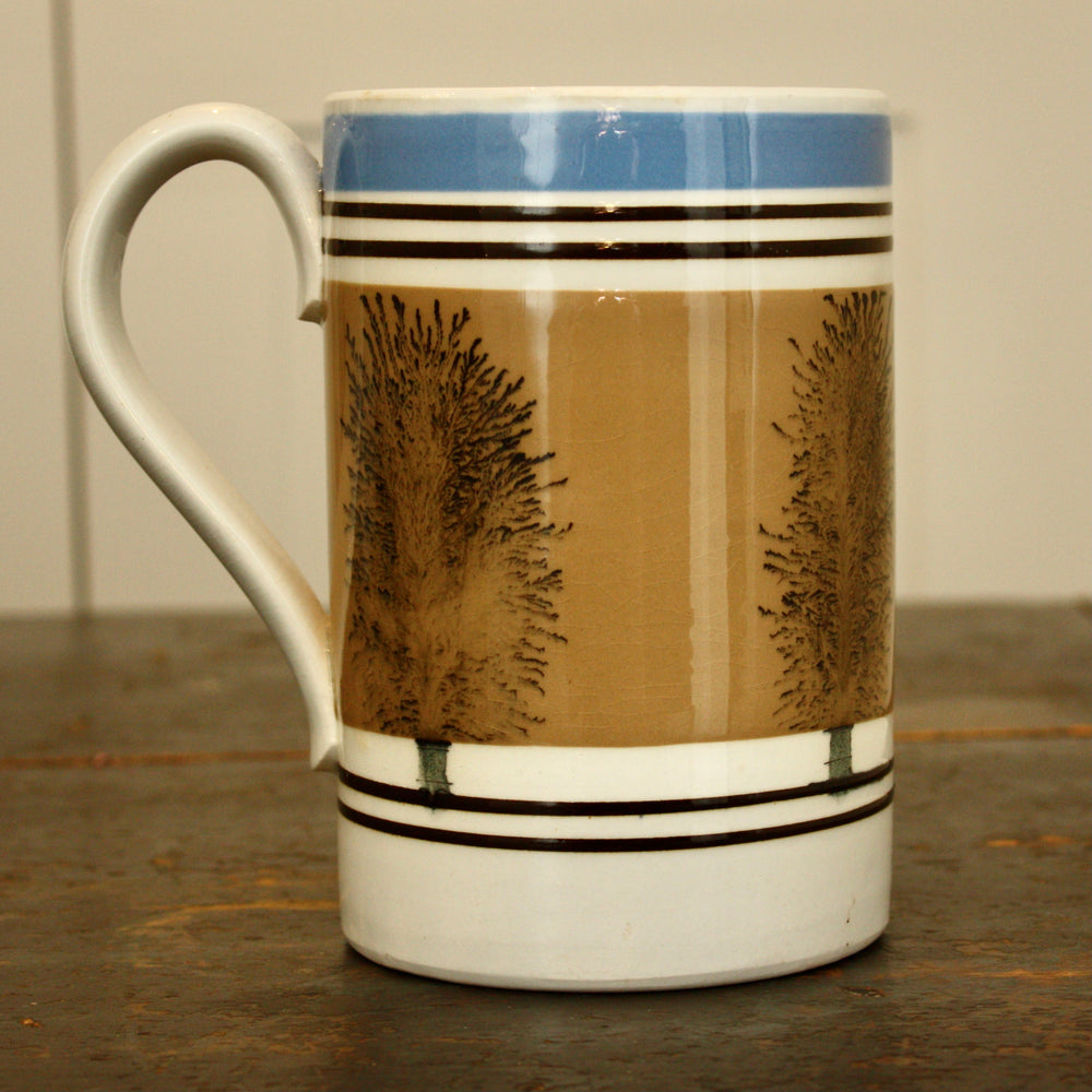 z ... sold ...an edwardian mochaware quart measure tankard.