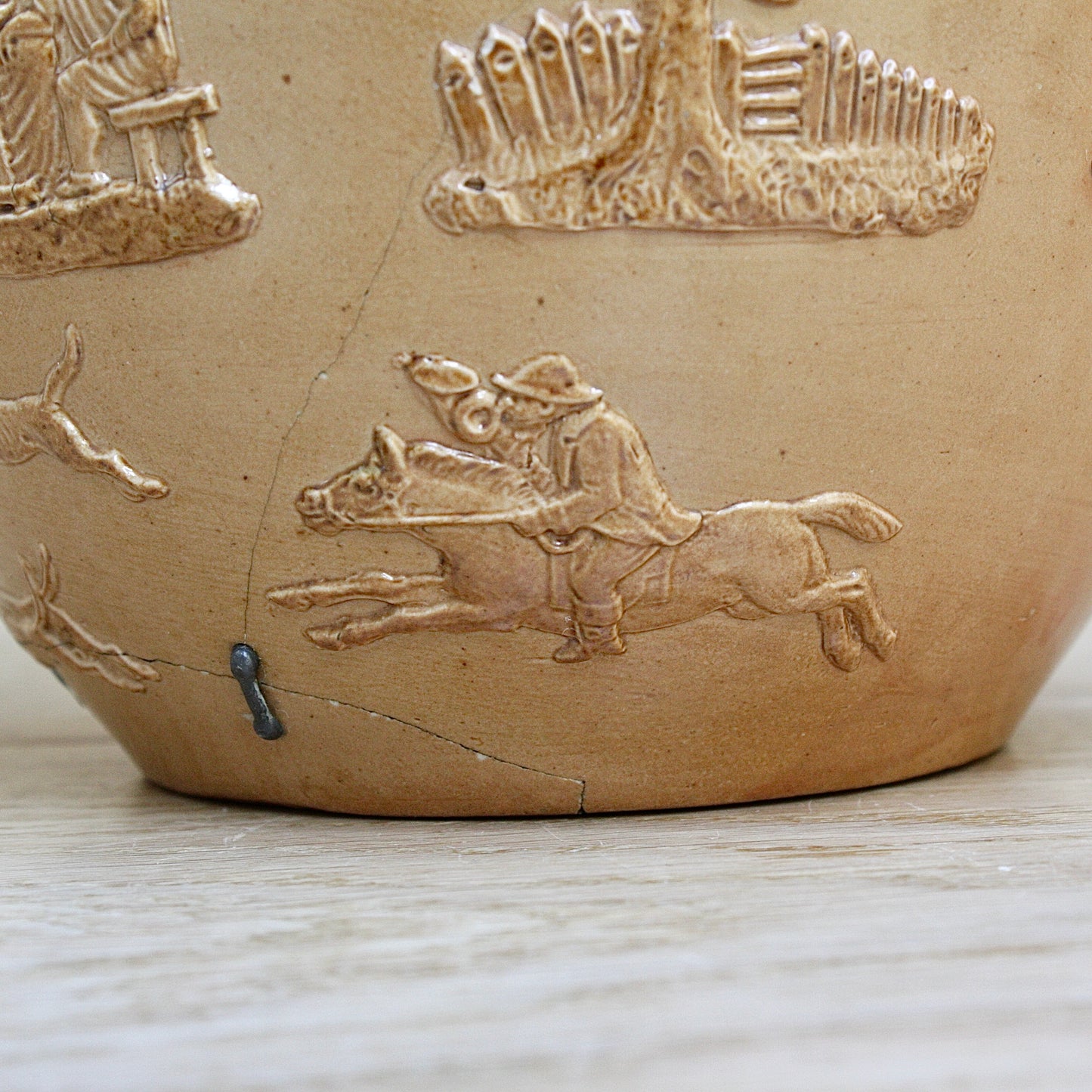 
                  
                    a splendid staple and rivet repaired doulton of lambeth "harvest" jug
                  
                