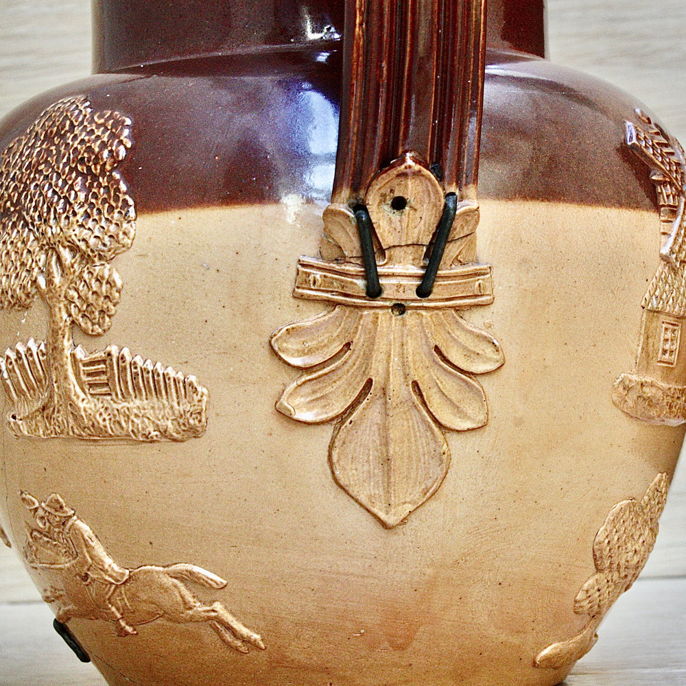 
                  
                    a splendid staple and rivet repaired doulton of lambeth "harvest" jug
                  
                