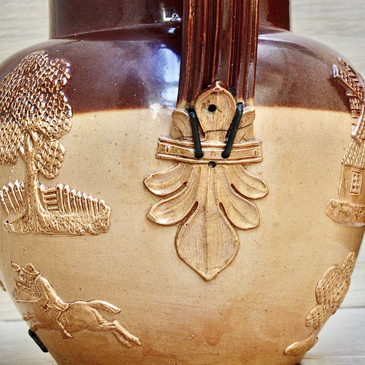 
                  
                    a splendid staple and rivet repaired doulton of lambeth "harvest" jug
                  
                