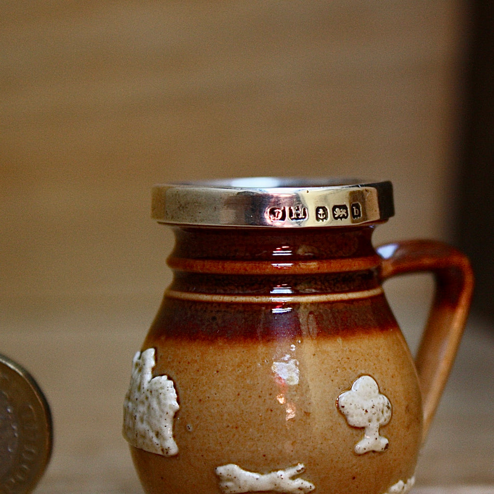 
                  
                    a miniature doulton of lambeth "harvest" jug.
                  
                