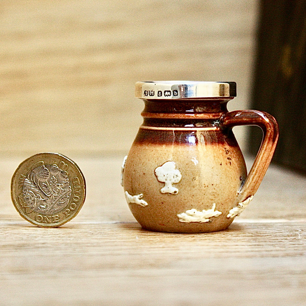 
                  
                    a miniature doulton of lambeth "harvest" jug.
                  
                