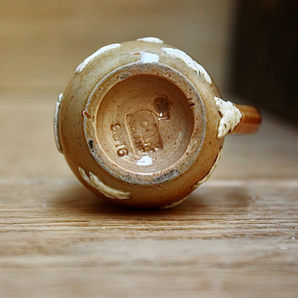 
                  
                    a miniature doulton of lambeth "harvest" jug.
                  
                