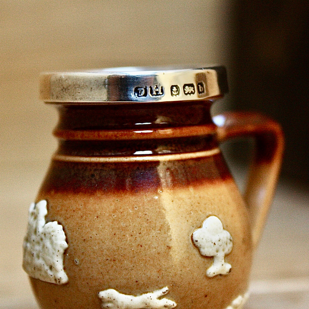 
                  
                    a miniature doulton of lambeth "harvest" jug.
                  
                