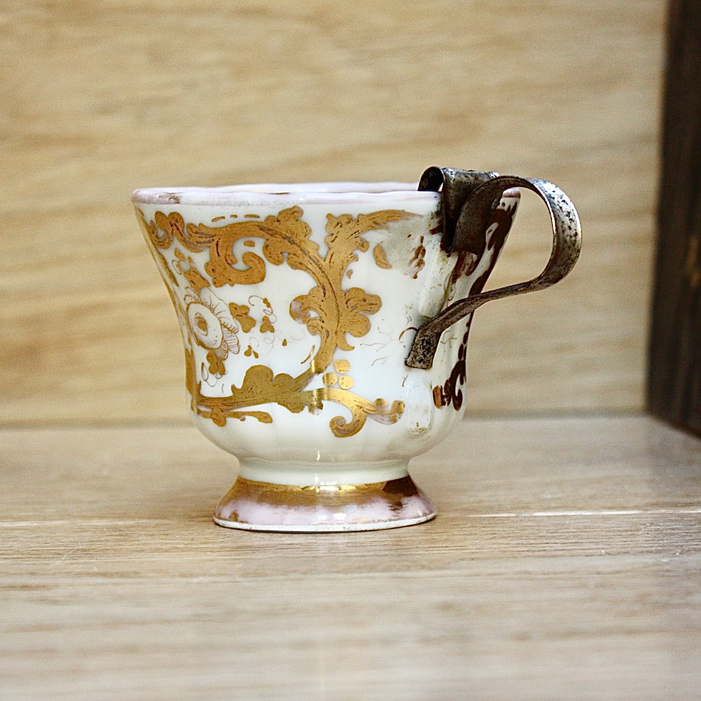 
                  
                    a cup by kpm with folk art appeal.
                  
                