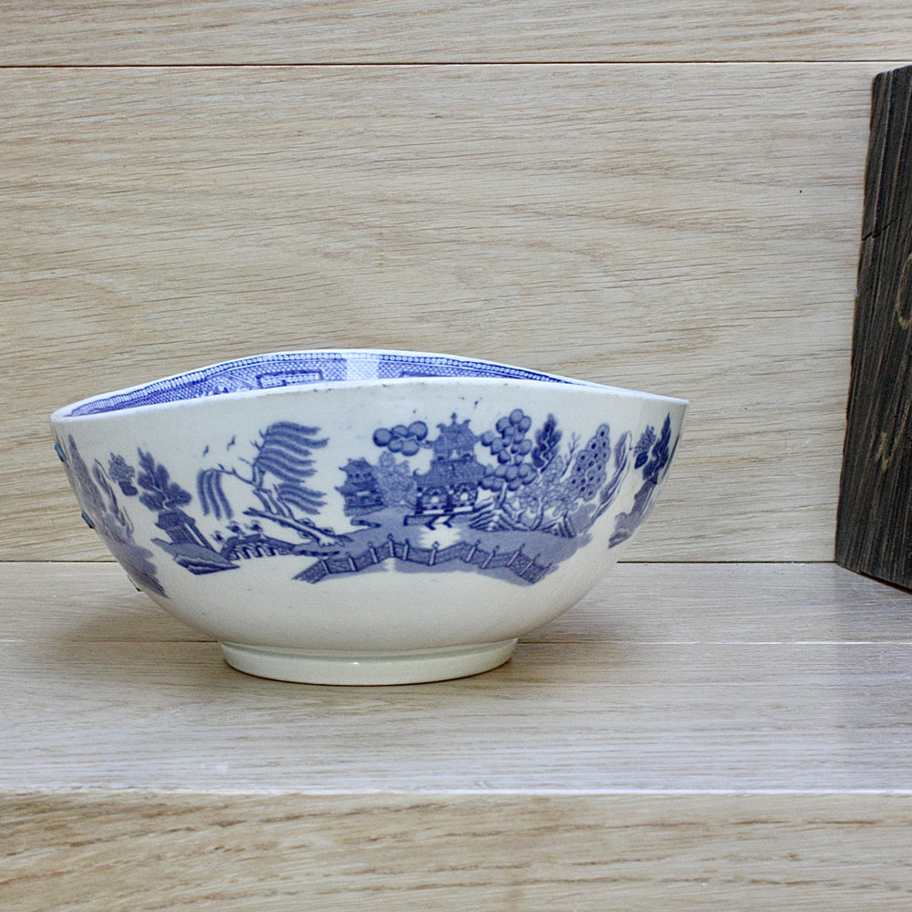 
                  
                    a staple repaired wedgwood willow pattern fruit bowl.
                  
                