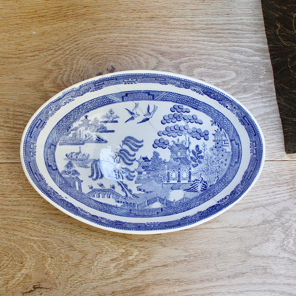 
                  
                    a staple repaired wedgwood willow pattern fruit bowl.
                  
                