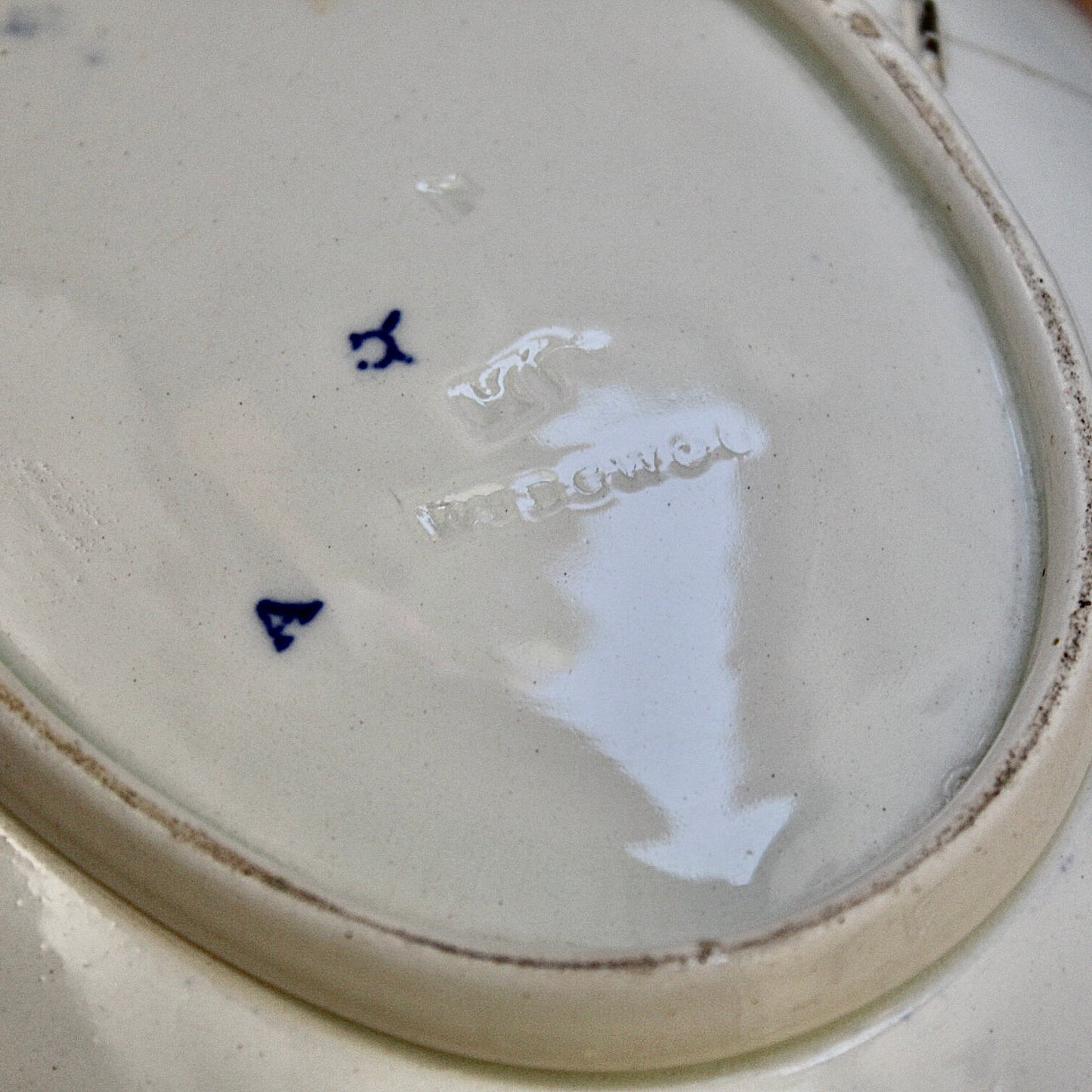 
                  
                    a staple repaired wedgwood willow pattern fruit bowl.
                  
                