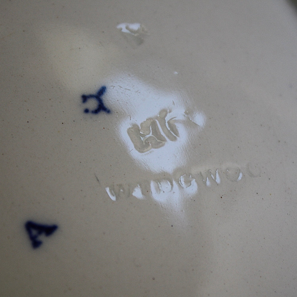 
                  
                    a staple repaired wedgwood willow pattern fruit bowl.
                  
                