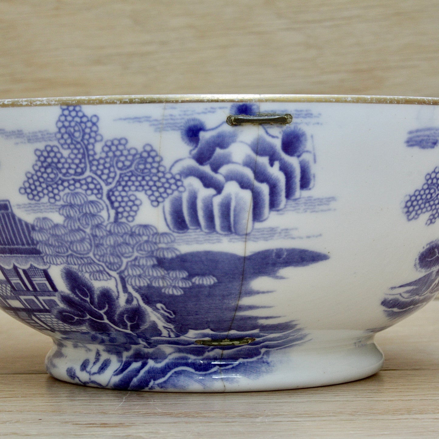 
                  
                    an early  staple repaired spode tea slop bowl.
                  
                