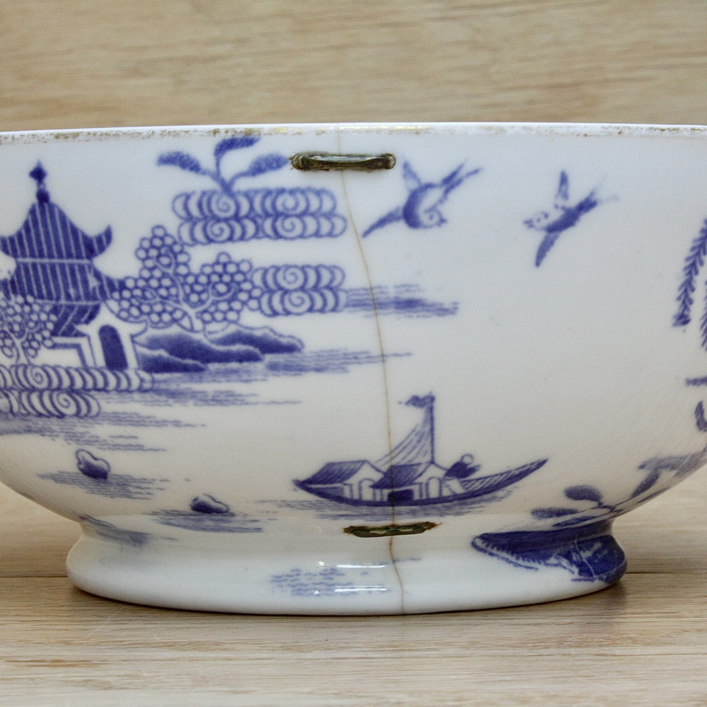 
                  
                    an early  staple repaired spode tea slop bowl.
                  
                