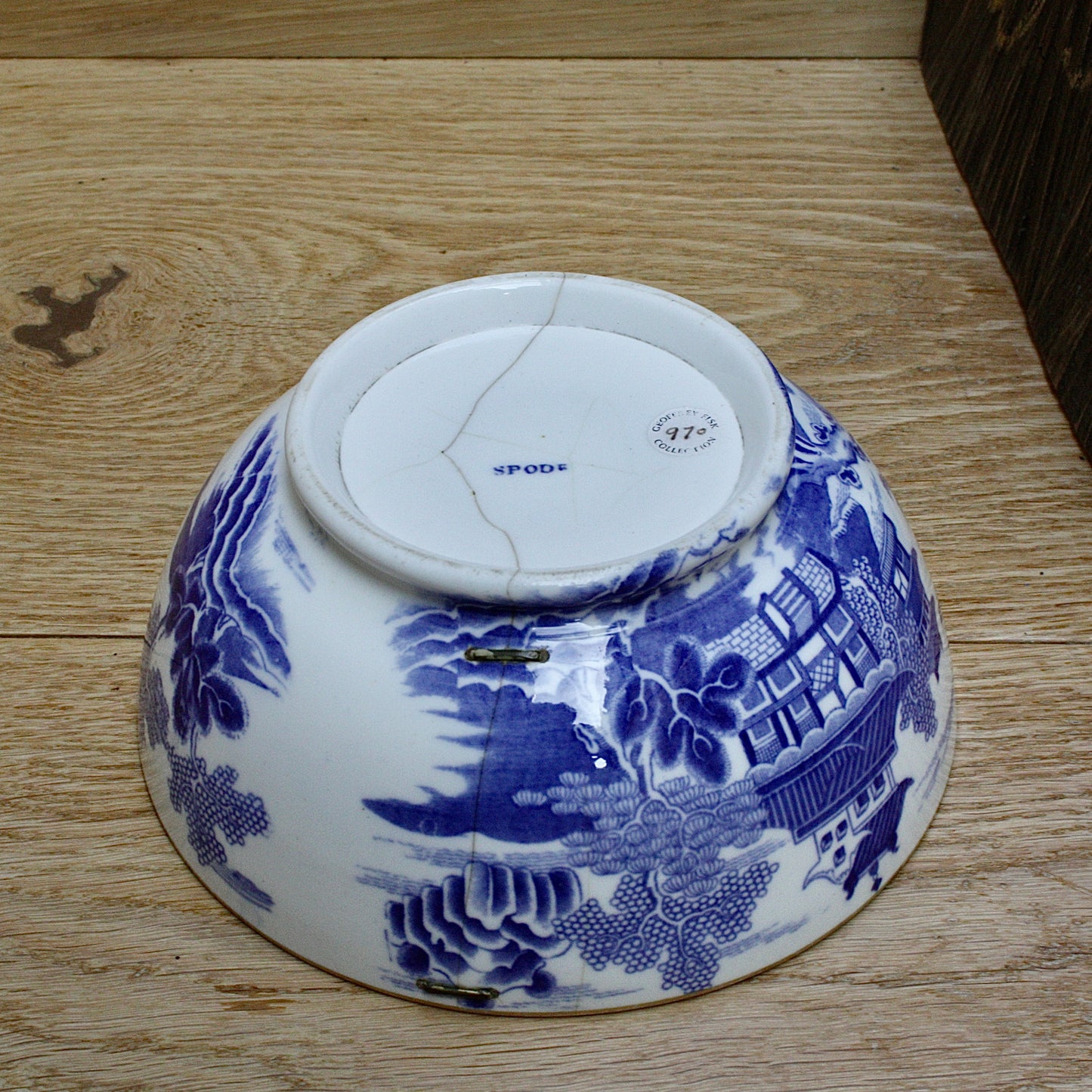 
                  
                    an early  staple repaired spode tea slop bowl.
                  
                