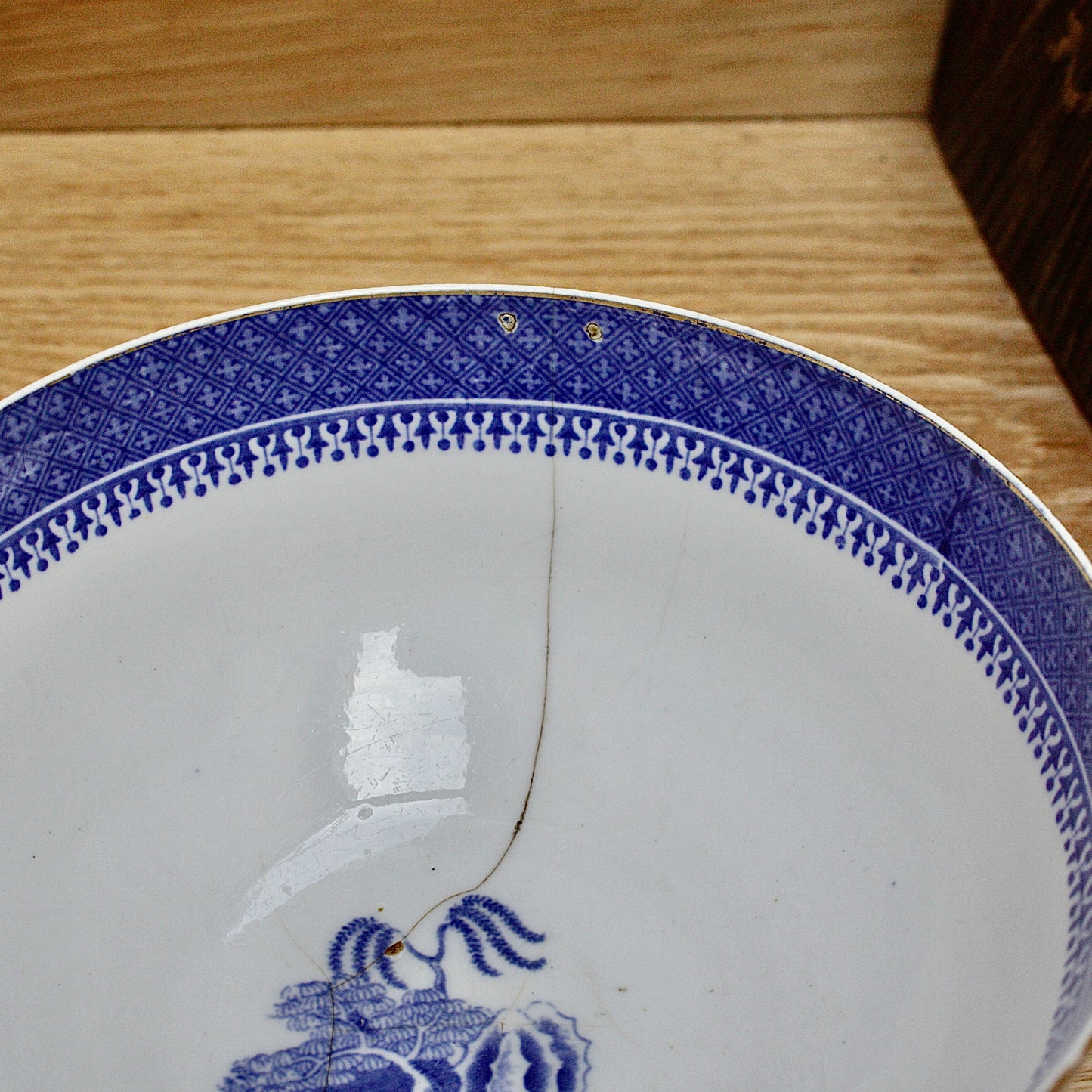 
                  
                    an early  staple repaired spode tea slop bowl.
                  
                