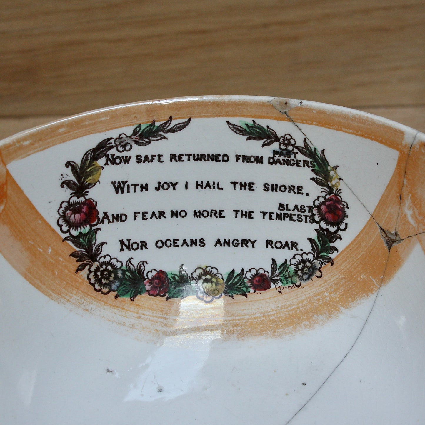 
                  
                    a glorious sunderland orange lustre bowl with an impressive staple repair.
                  
                