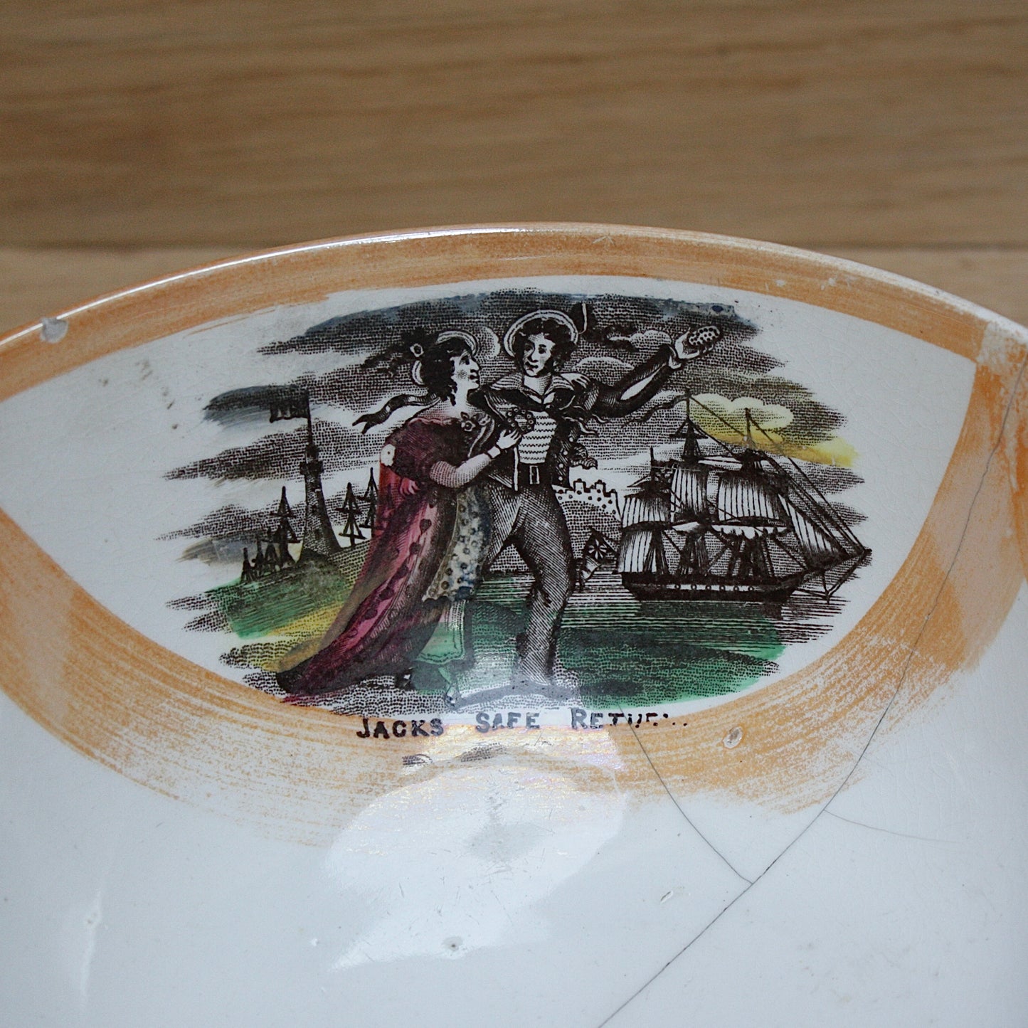 
                  
                    a glorious sunderland orange lustre bowl with an impressive staple repair.
                  
                