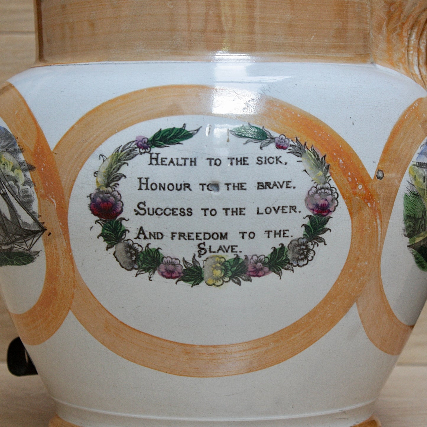 
                  
                    a huge sunderland orange lustre jug with a tinker made copper handle.
                  
                