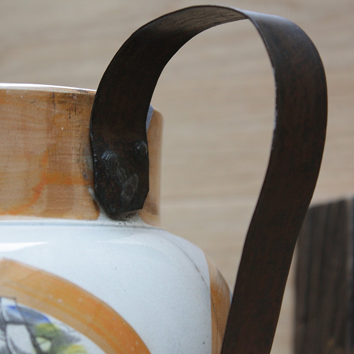 
                  
                    a huge sunderland orange lustre jug with a tinker made copper handle.
                  
                