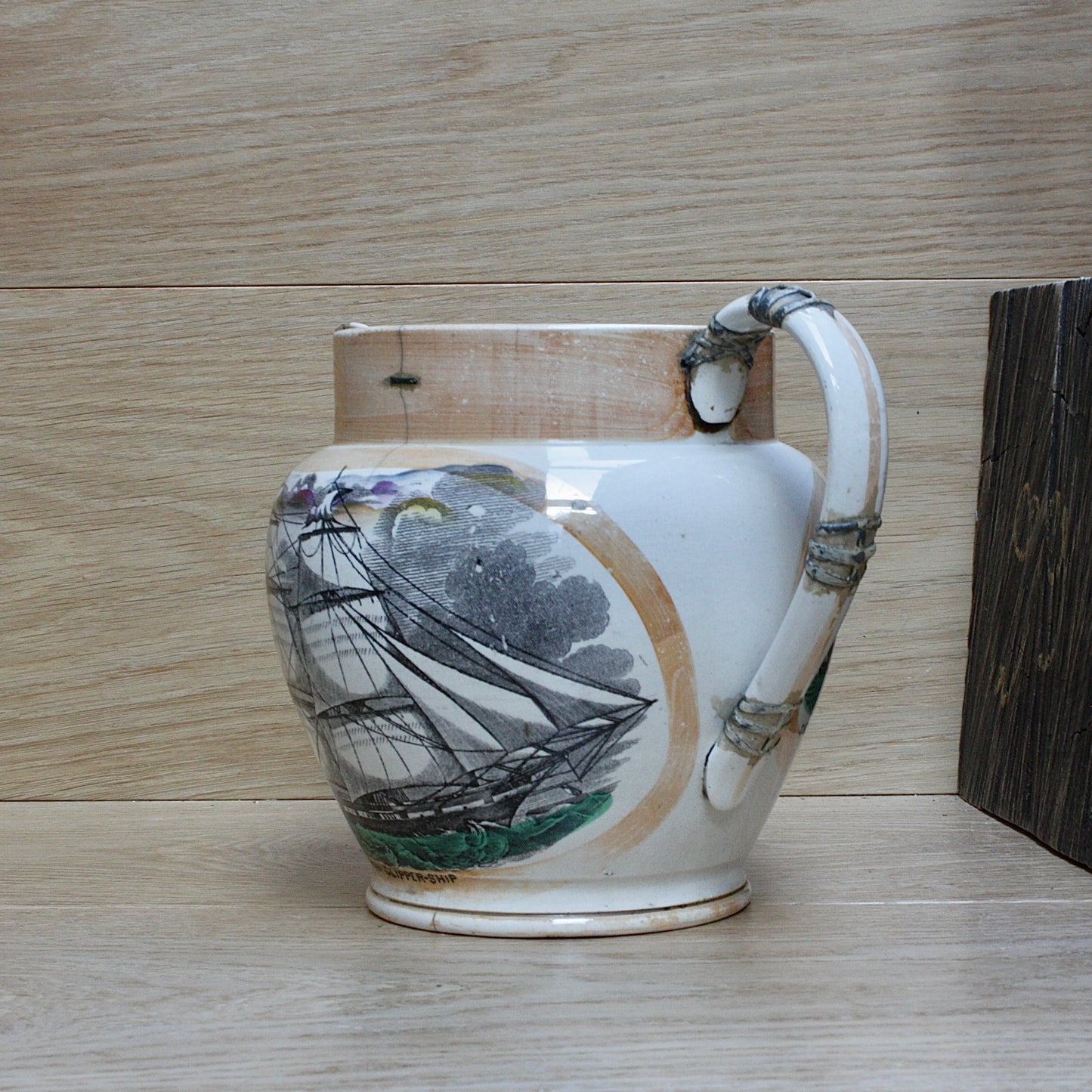 
                  
                    a  large antique Sunderland Lustre jug " the clipper ship great Australia " with tinker repaired handle.
                  
                