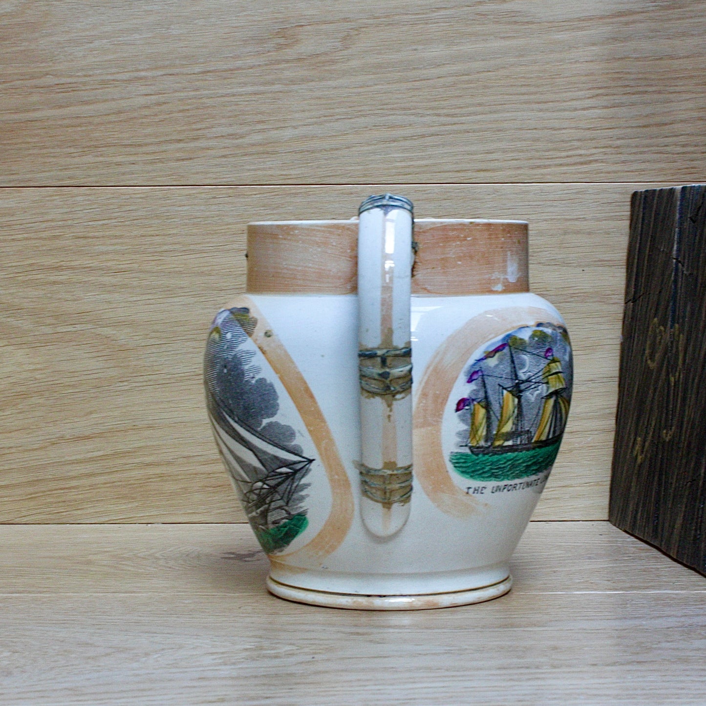 
                  
                    a  large antique Sunderland Lustre jug " the clipper ship great Australia " with tinker repaired handle.
                  
                