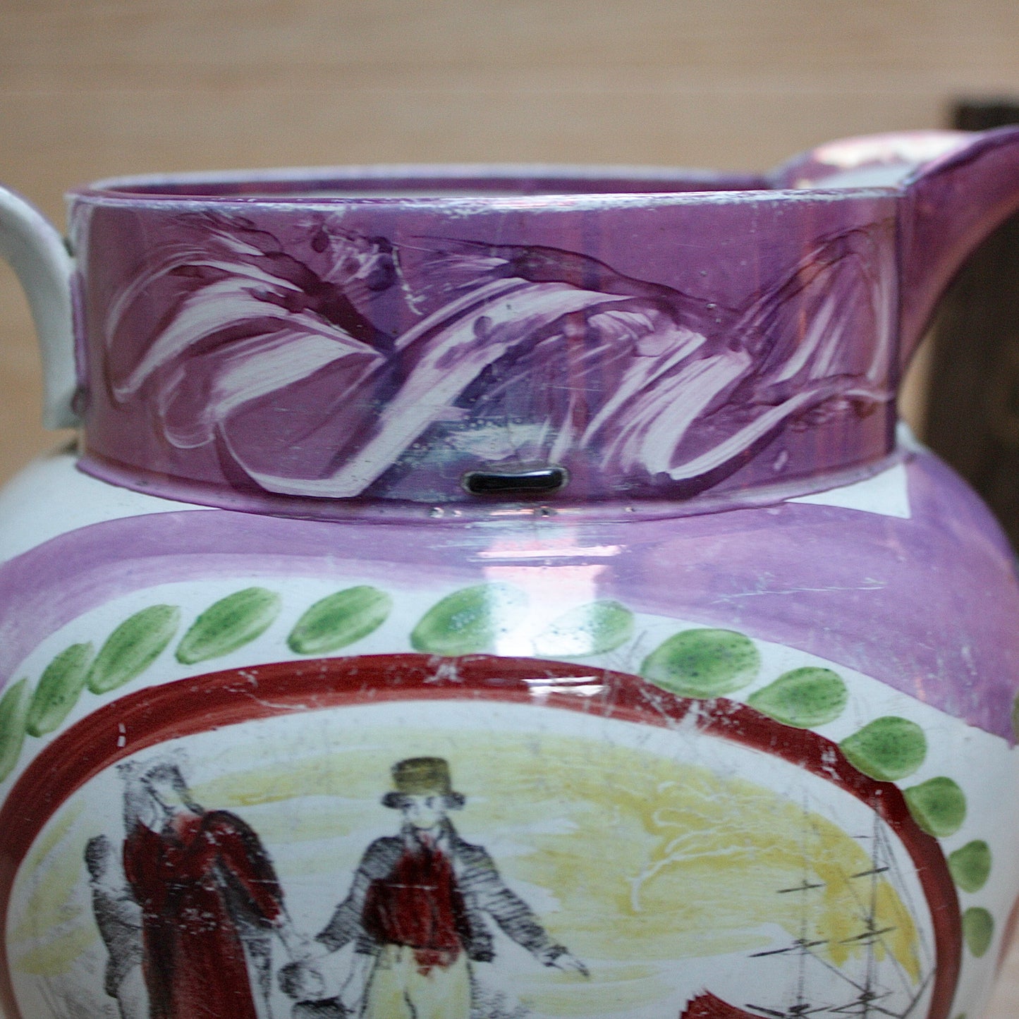 
                  
                    a large antique purple sunderland lustre jug with a single staple repair.
                  
                