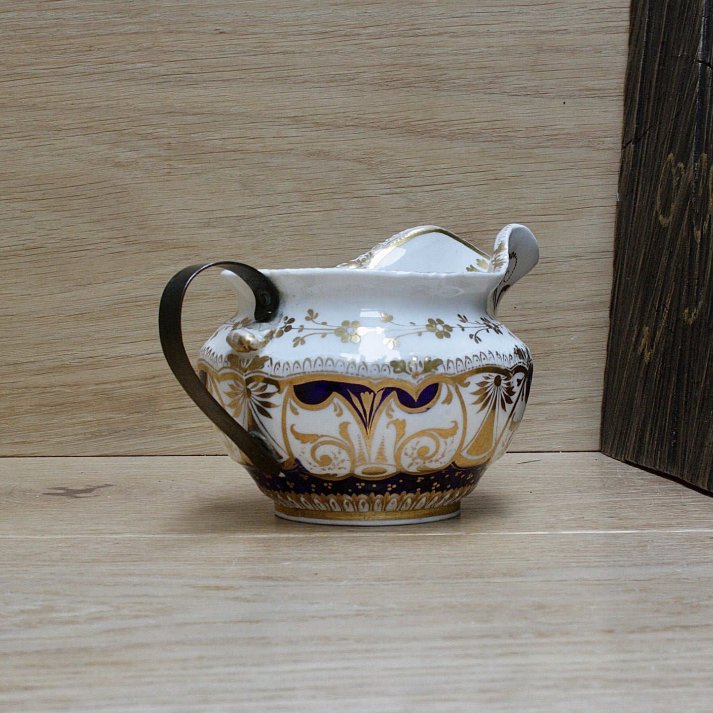 
                  
                    a bone china cream jug.
                  
                