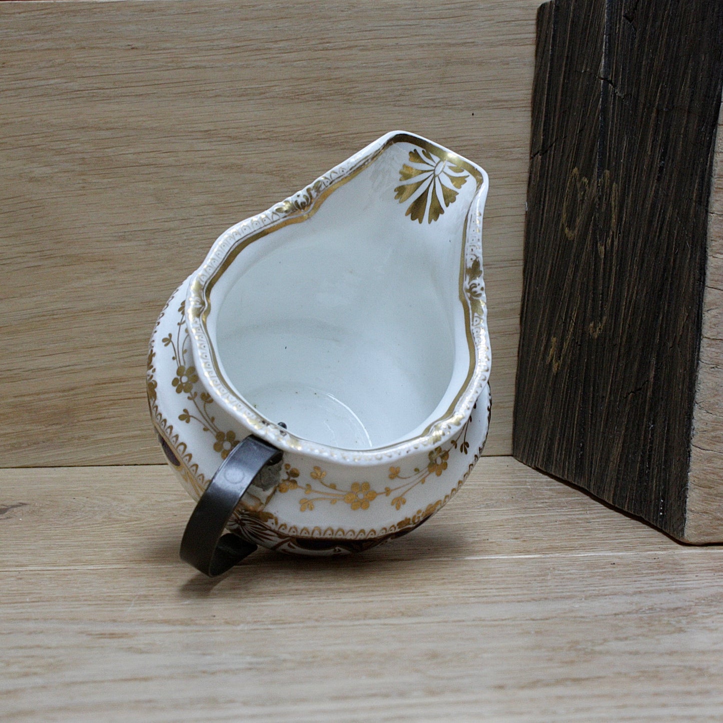 
                  
                    a bone china cream jug.
                  
                