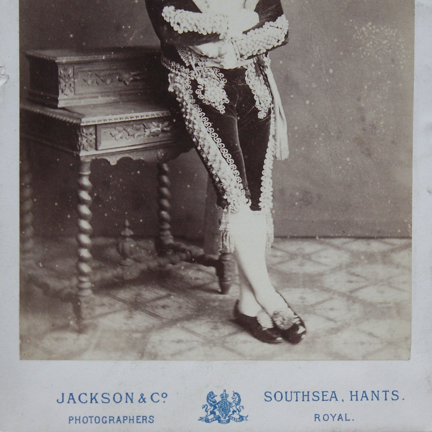 
                  
                    an unusual framed victorian cabinet card possibly of a matador
                  
                