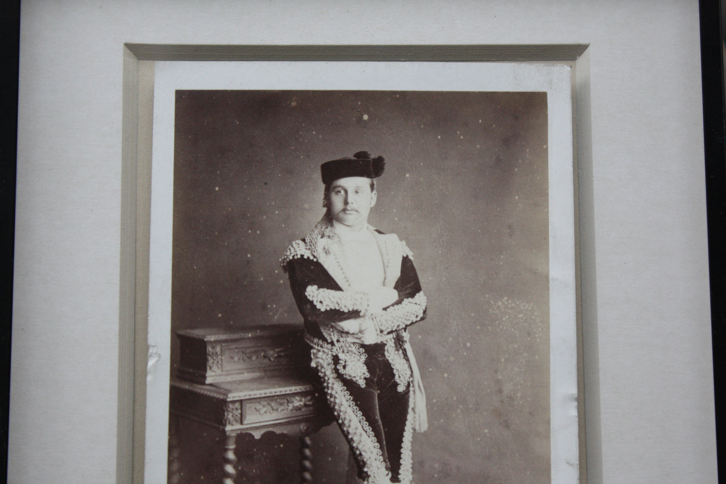 
                  
                    an unusual framed victorian cabinet card possibly of a matador
                  
                
