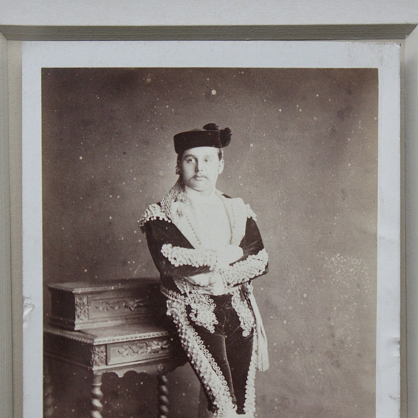 
                  
                    an unusual framed victorian cabinet card possibly of a matador
                  
                