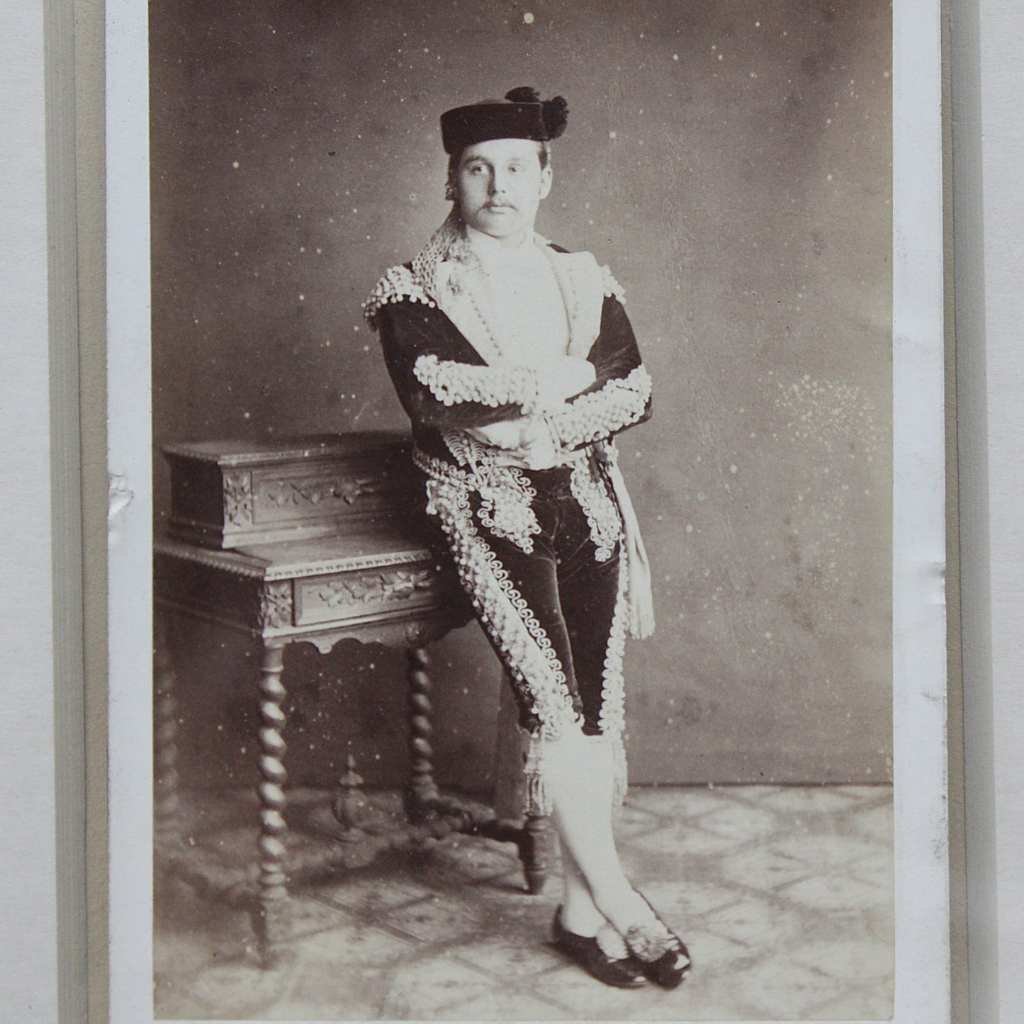 
                  
                    an unusual framed victorian cabinet card possibly of a matador
                  
                