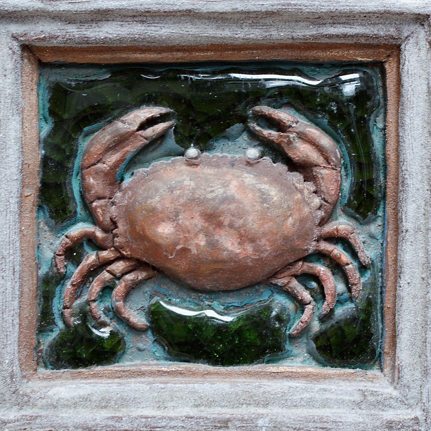 
                  
                    a brown  crab pottery portrait.
                  
                