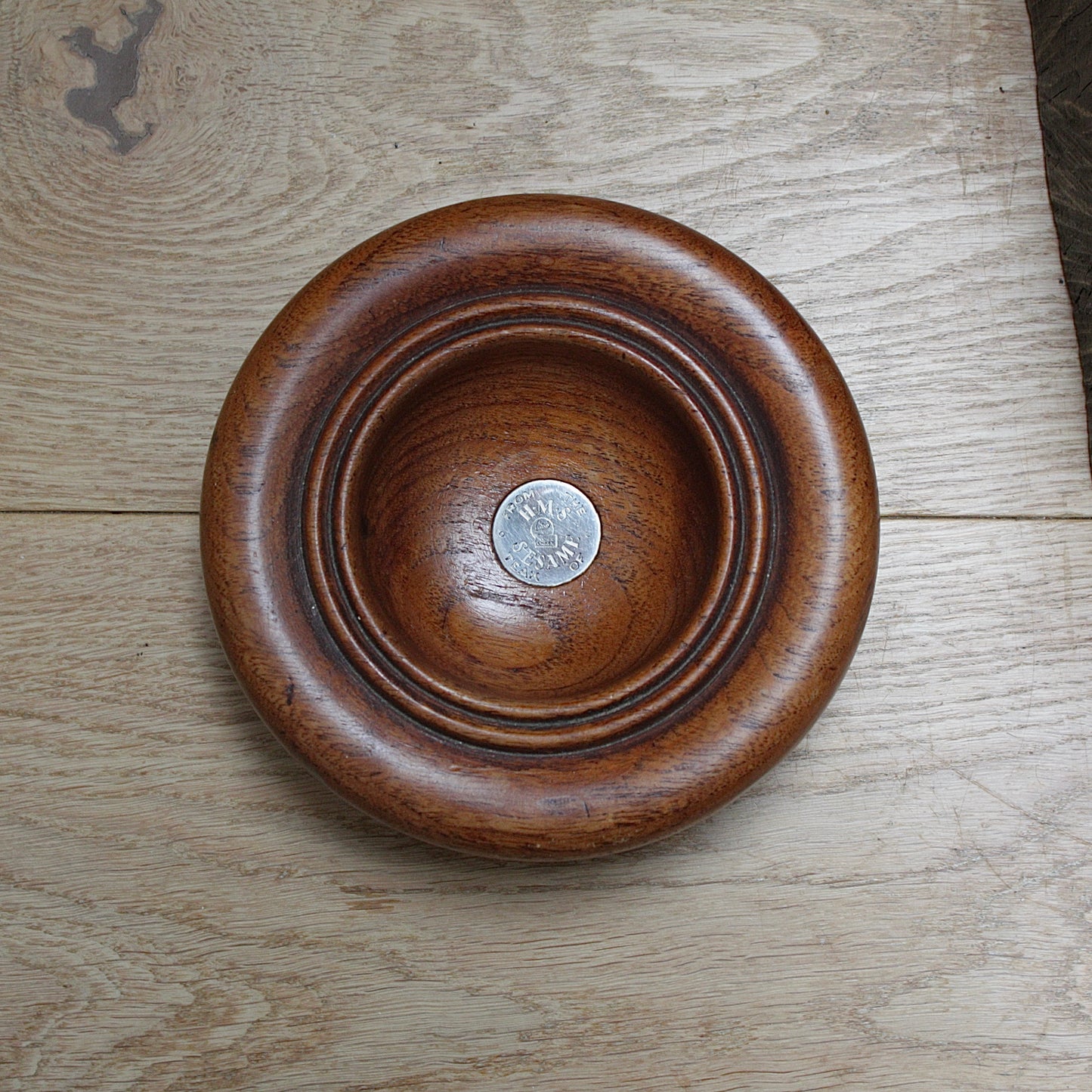 
                  
                    a bowl made from the teak of hms sesame
                  
                