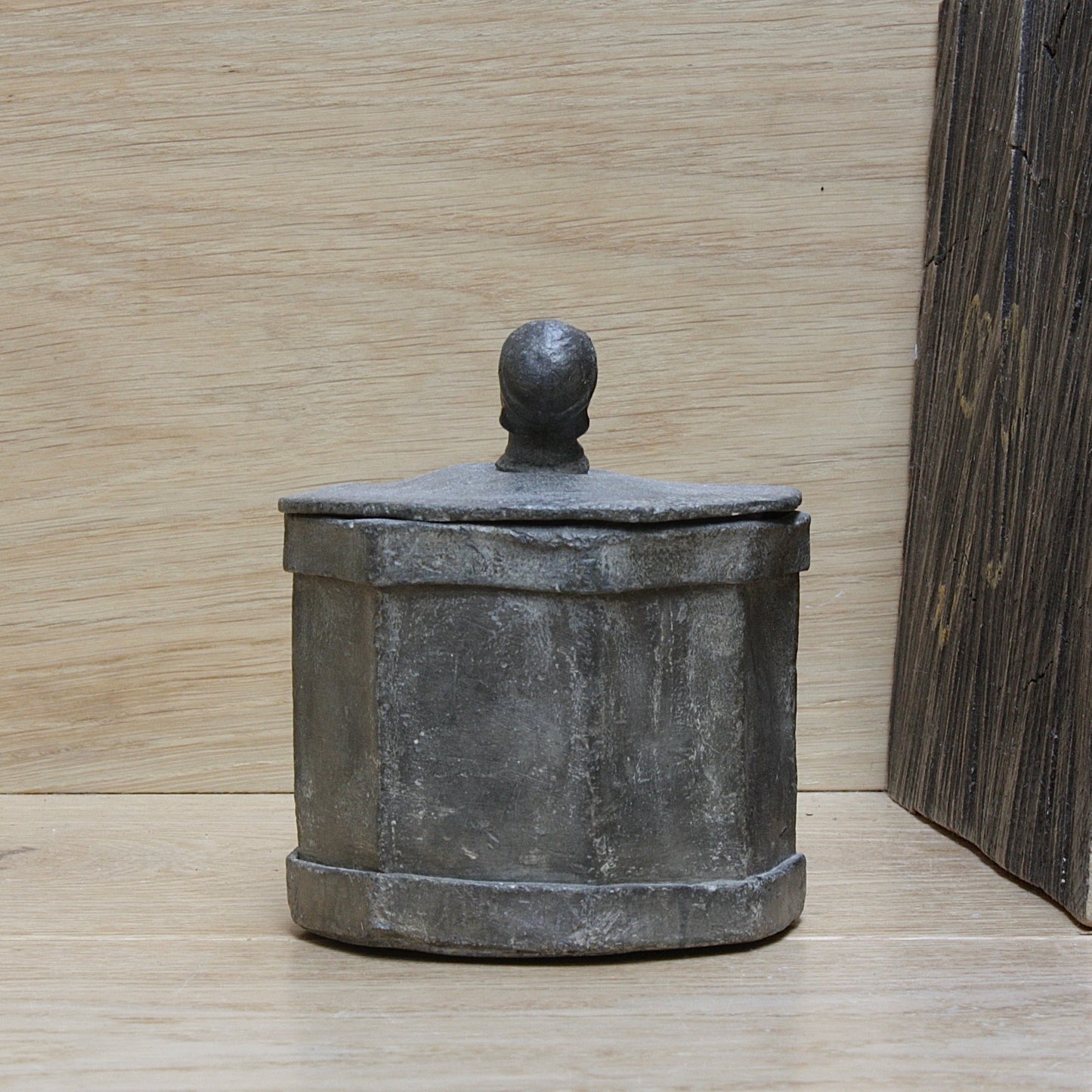 
                  
                    an early antique Georgian lead tobacco box.
                  
                