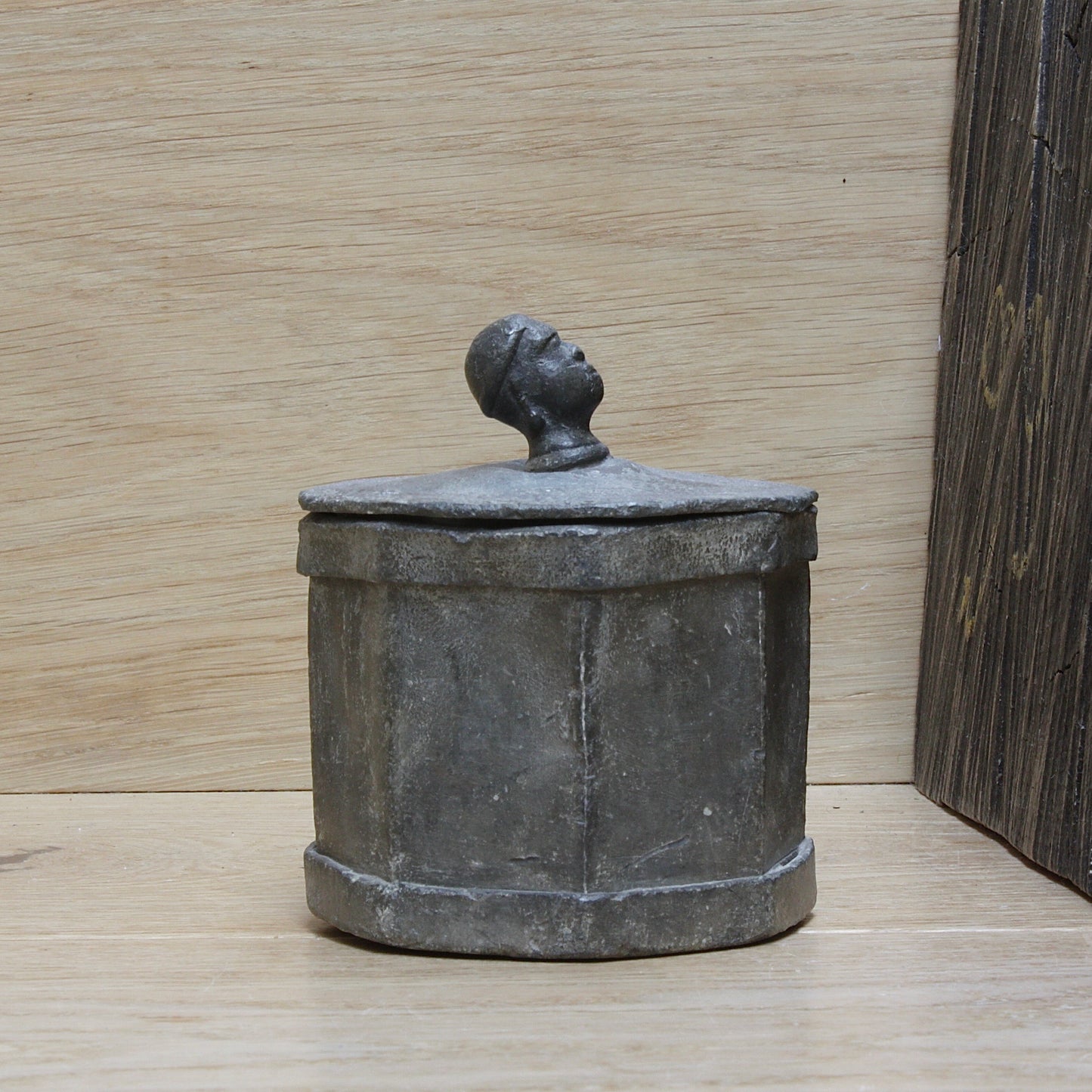 
                  
                    an early antique Georgian lead tobacco box.
                  
                