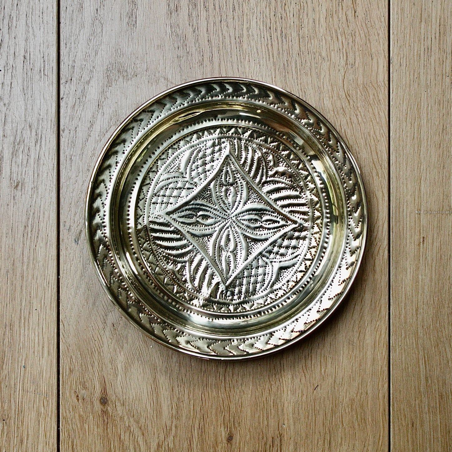 
                  
                    no.1 a small hand embossed brass dish from old calabar.
                  
                