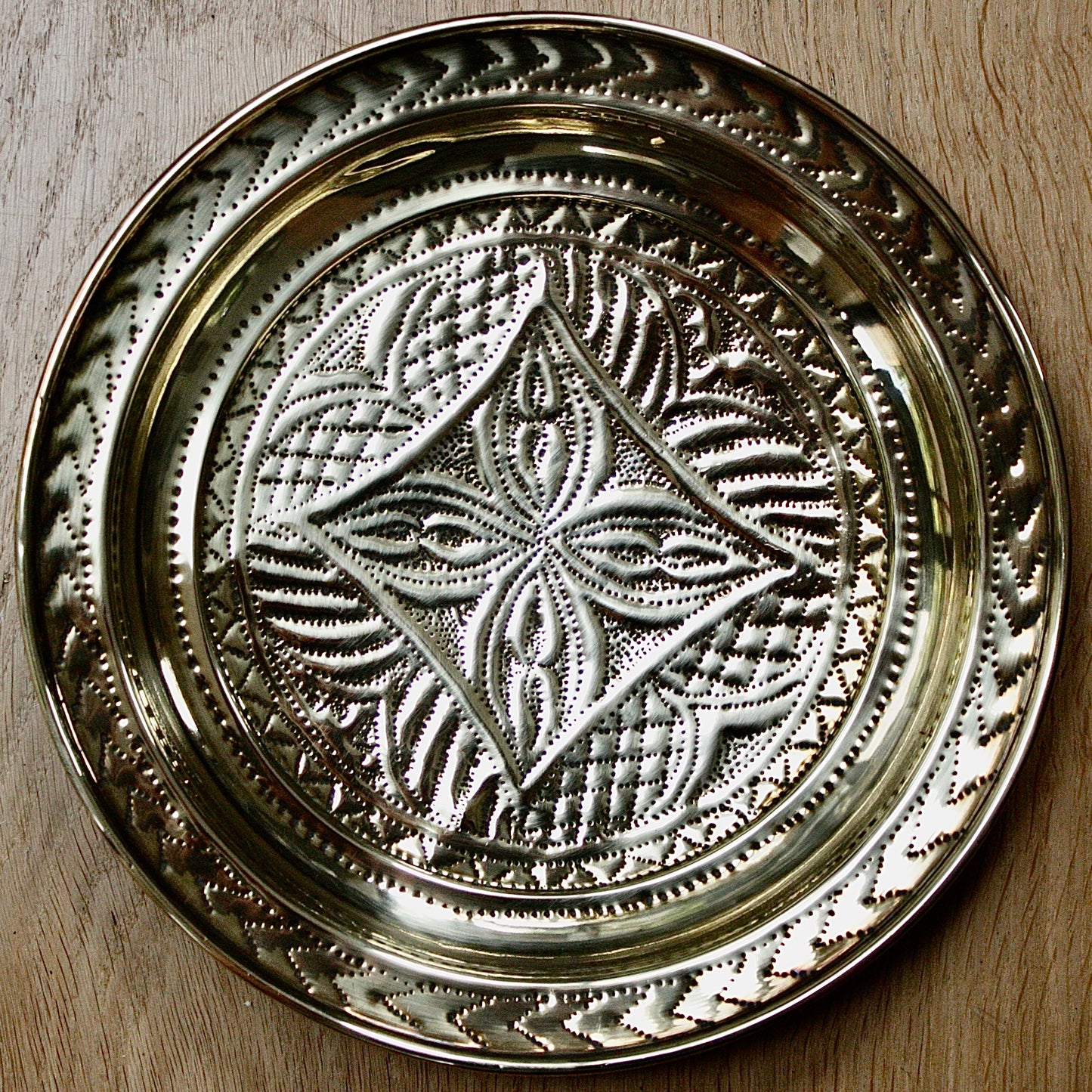 
                  
                    no.1 a small hand embossed brass dish from old calabar.
                  
                