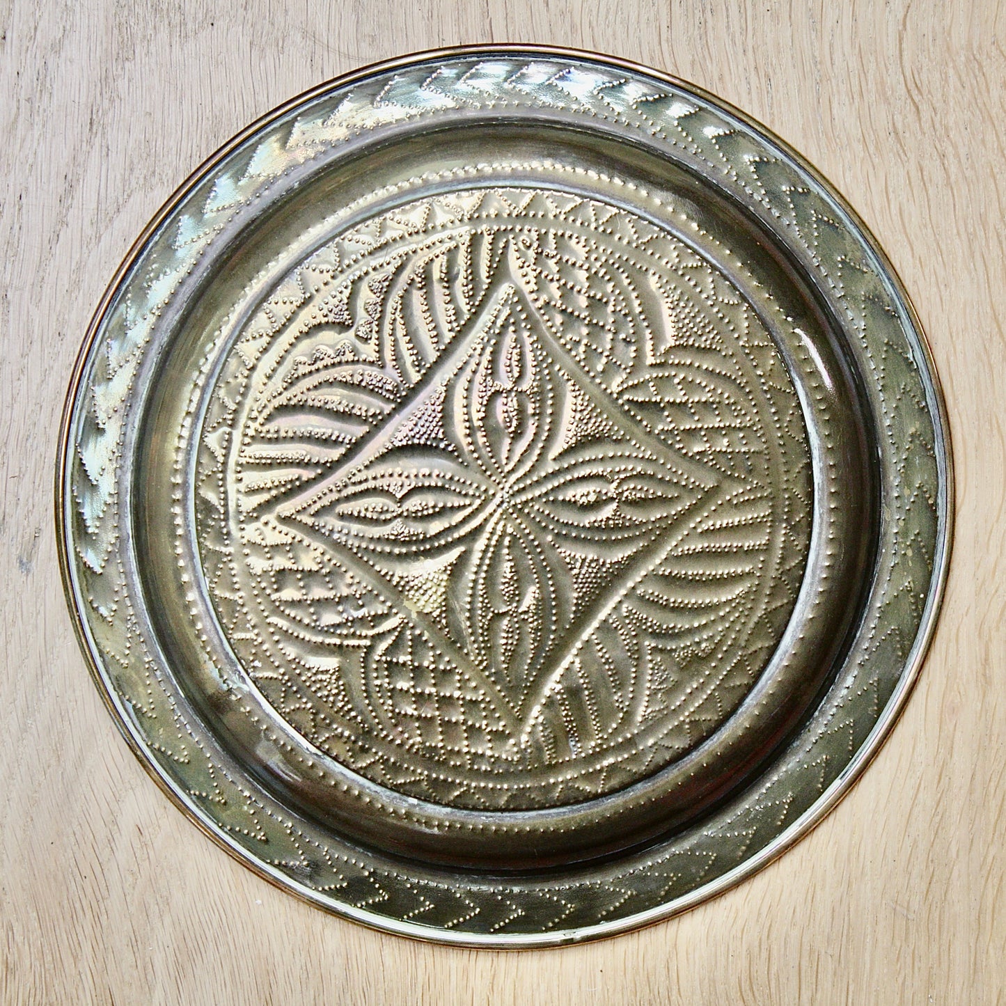
                  
                    no.1 a small hand embossed brass dish from old calabar.
                  
                