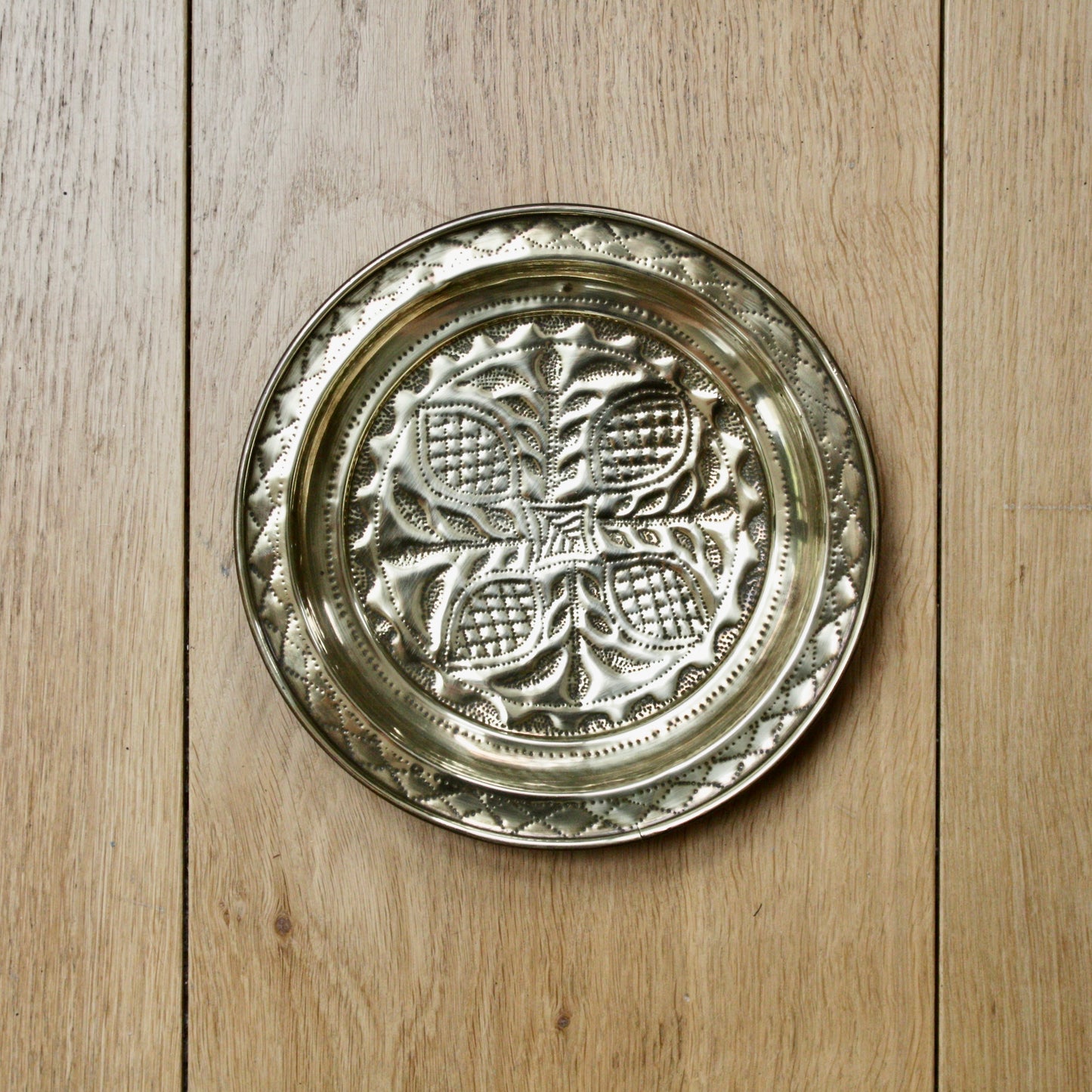 
                  
                    no.2 a small hand embossed brass dish from old calabar.
                  
                