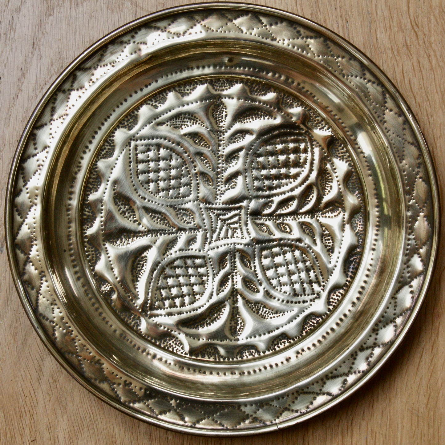 
                  
                    no.2 a small hand embossed brass dish from old calabar.
                  
                