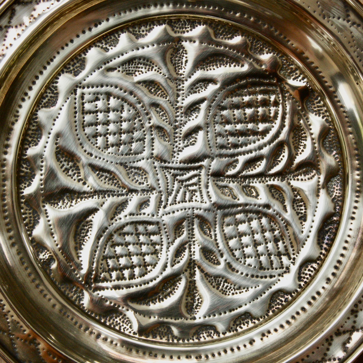 
                  
                    no.2 a small hand embossed brass dish from old calabar.
                  
                
