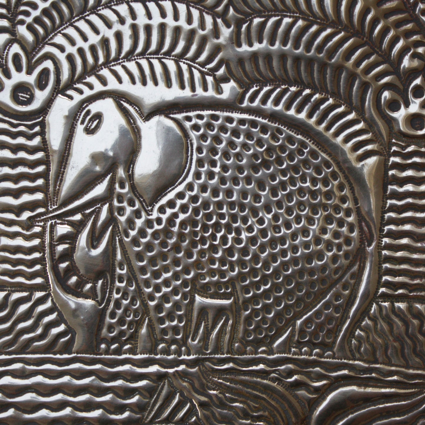
                  
                    a. large brass efic charger. depicting calabar wildlife
                  
                