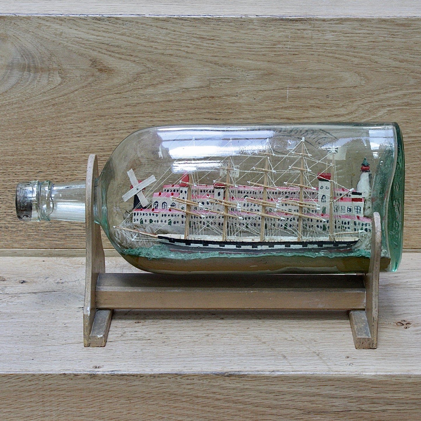 
                  
                    a highly detailed ship in a bottle dated 1914-15
                  
                