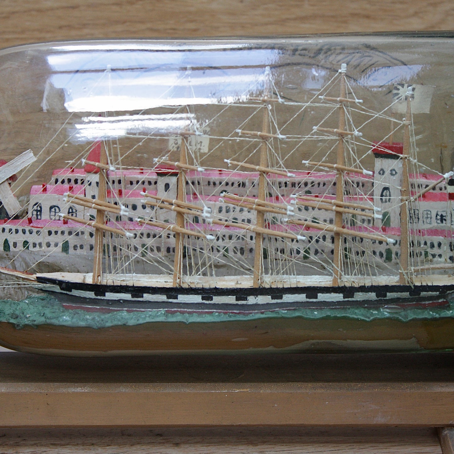 
                  
                    a highly detailed ship in a bottle dated 1914-15
                  
                