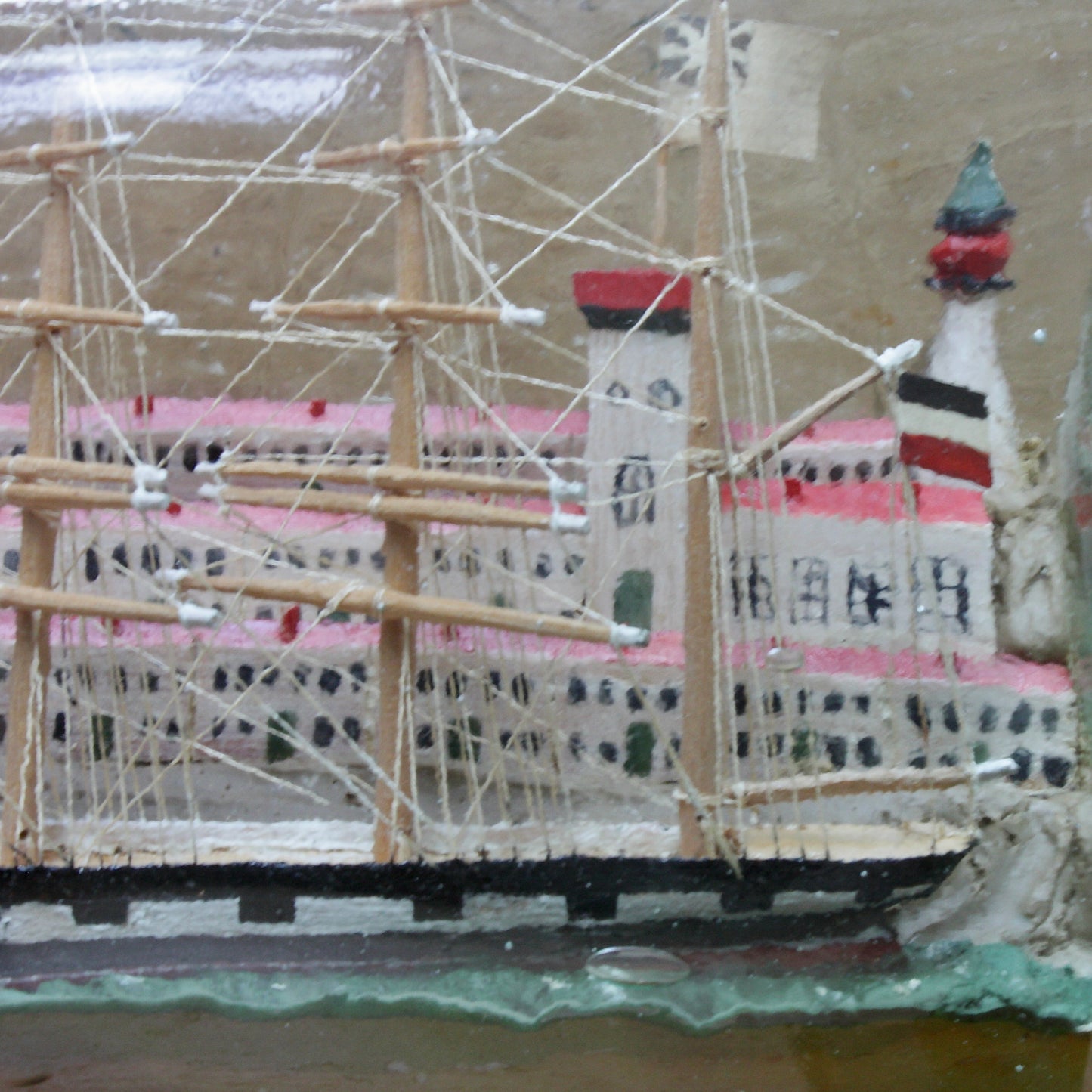 
                  
                    a highly detailed ship in a bottle dated 1914-15
                  
                