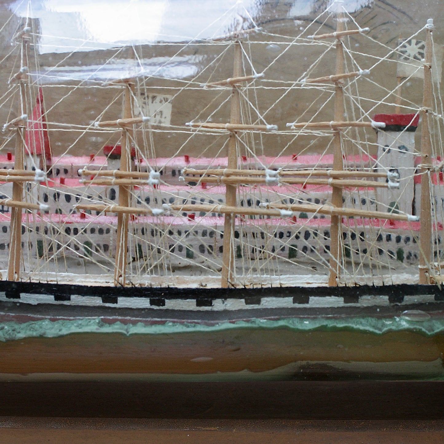 
                  
                    a highly detailed ship in a bottle dated 1914-15
                  
                