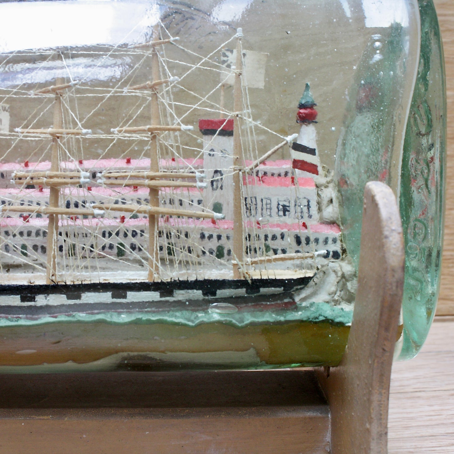 
                  
                    a highly detailed ship in a bottle dated 1914-15
                  
                