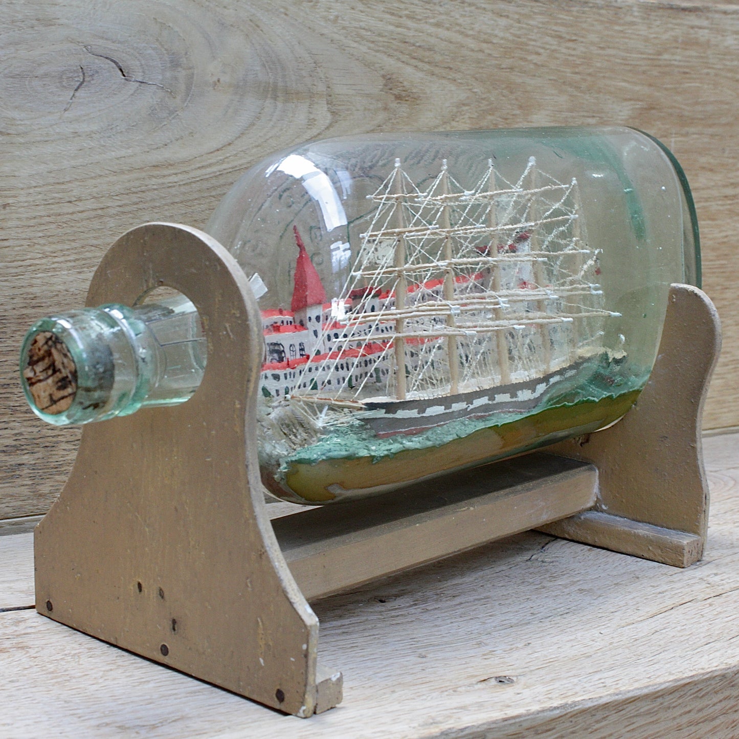 
                  
                    a highly detailed ship in a bottle dated 1914-15
                  
                