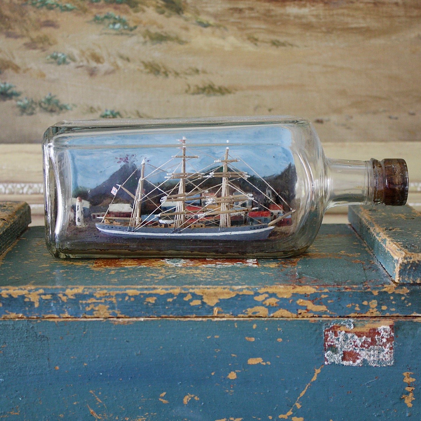 
                  
                    a ship in a bottle with volcano.
                  
                