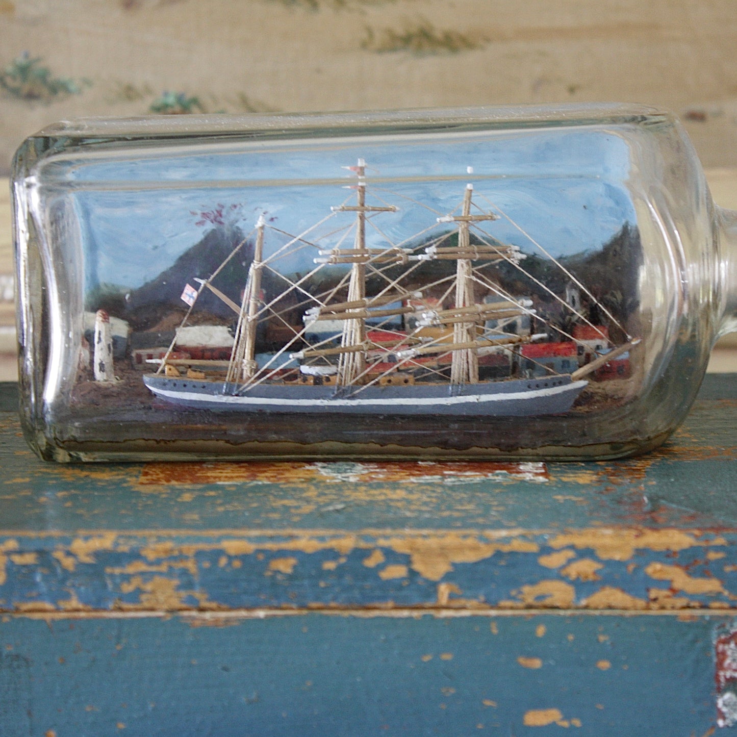 
                  
                    a ship in a bottle with volcano.
                  
                